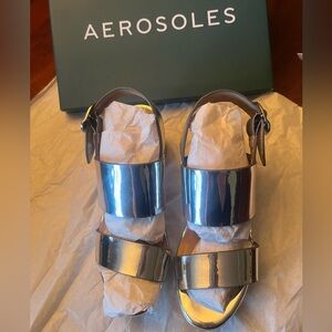 AEROSOLE CAMERA SANDAL in silver metallic. Brand new